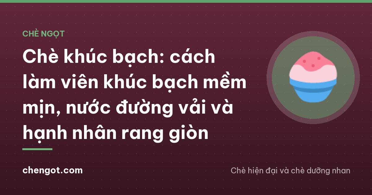 Close-up of a spoon lifting a soft white milk jelly cube from a glass bowl with lychees, toasted almond slices and crushed ice, warm kitchen light